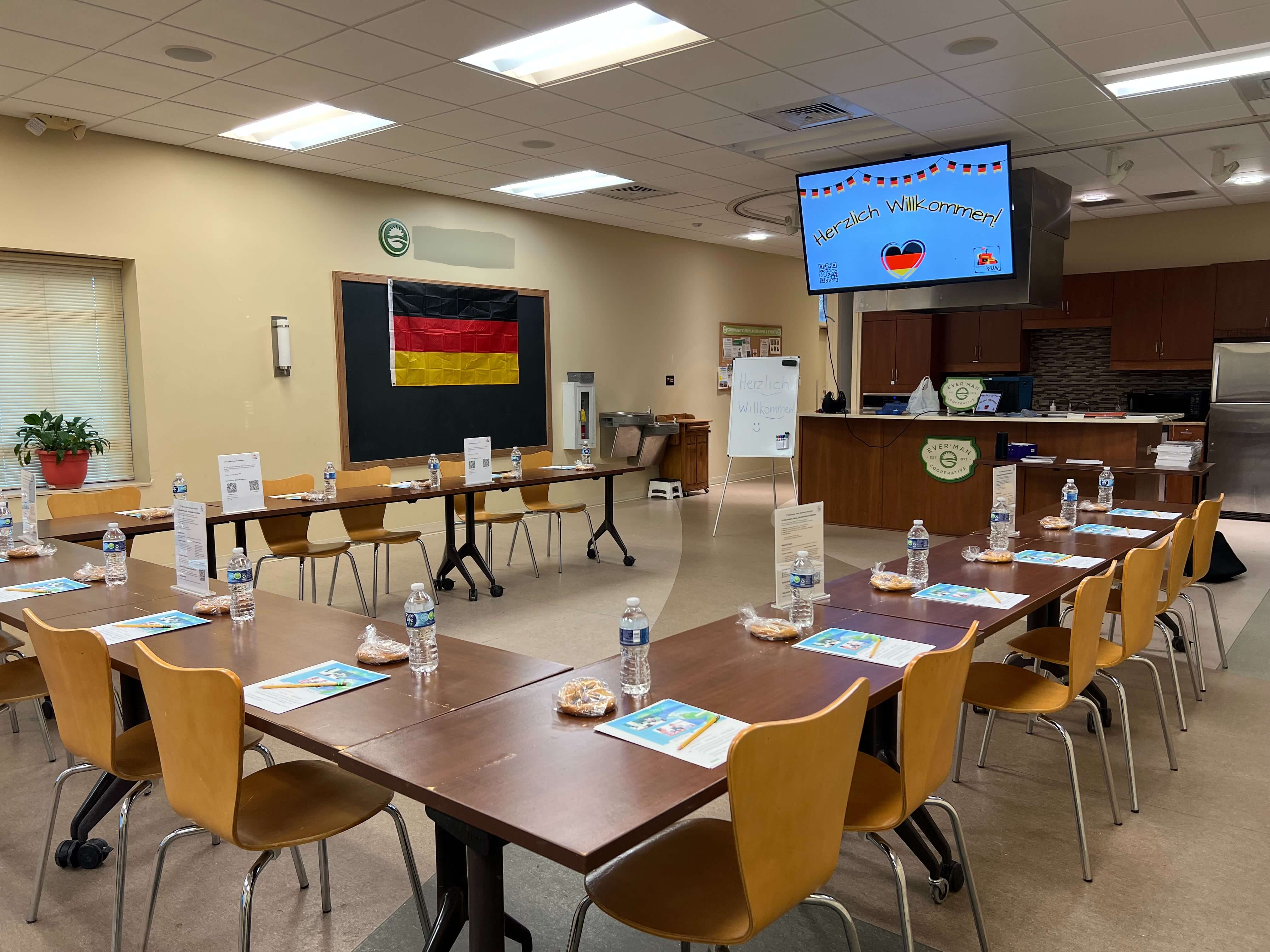 German4FUN classroom ready for students with welcome screen and neatly set tables.