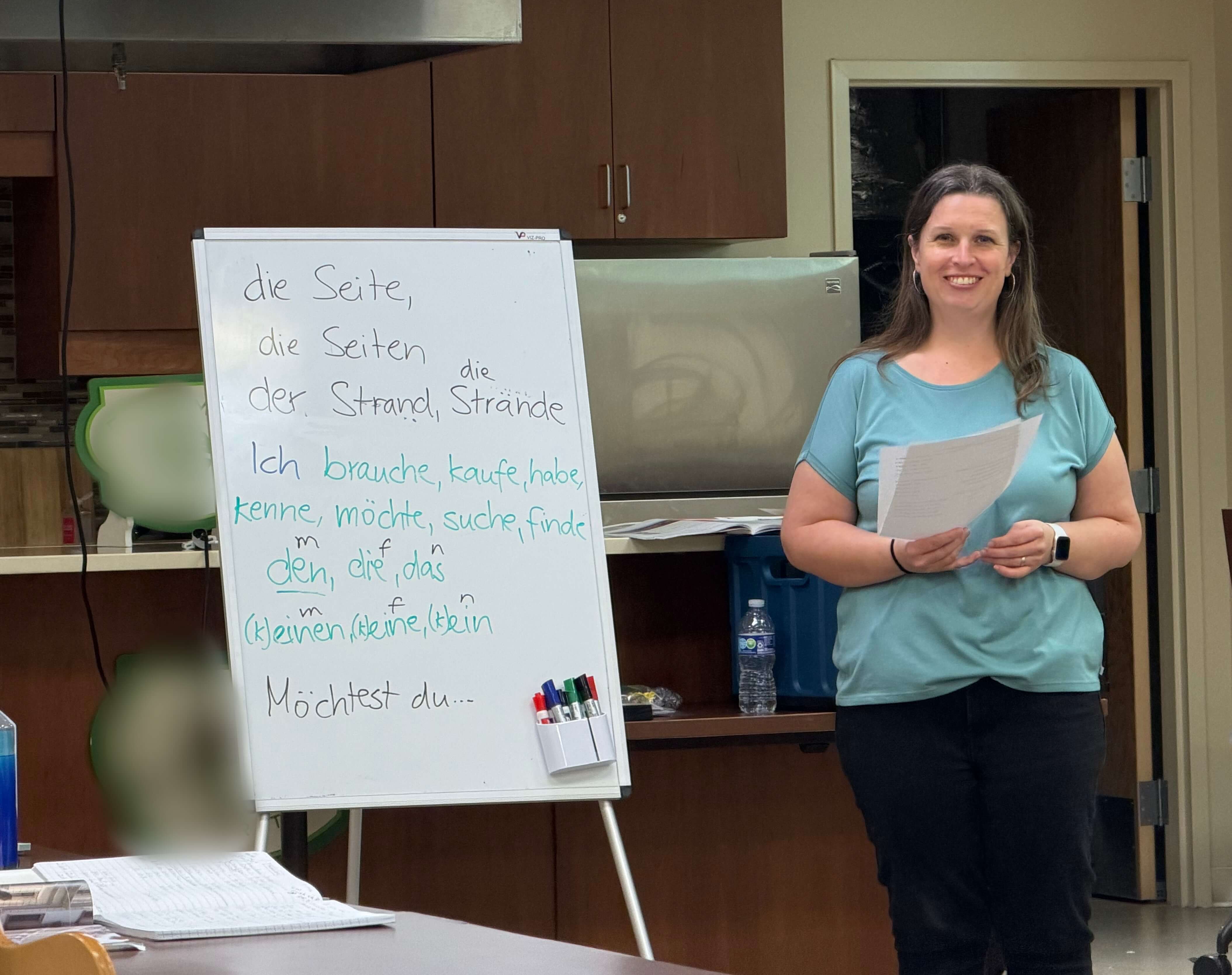German teacher Gesa teaching an adult German class in Pensacola